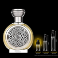 Gold and silver perfume bottle with intricate design, accompanied by smaller bottles and measurements on a black background.