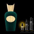 Green perfume bottle with gold cap and 'Vibrato' branding, accompanied by smaller bottles and measurement chart on a black background.
