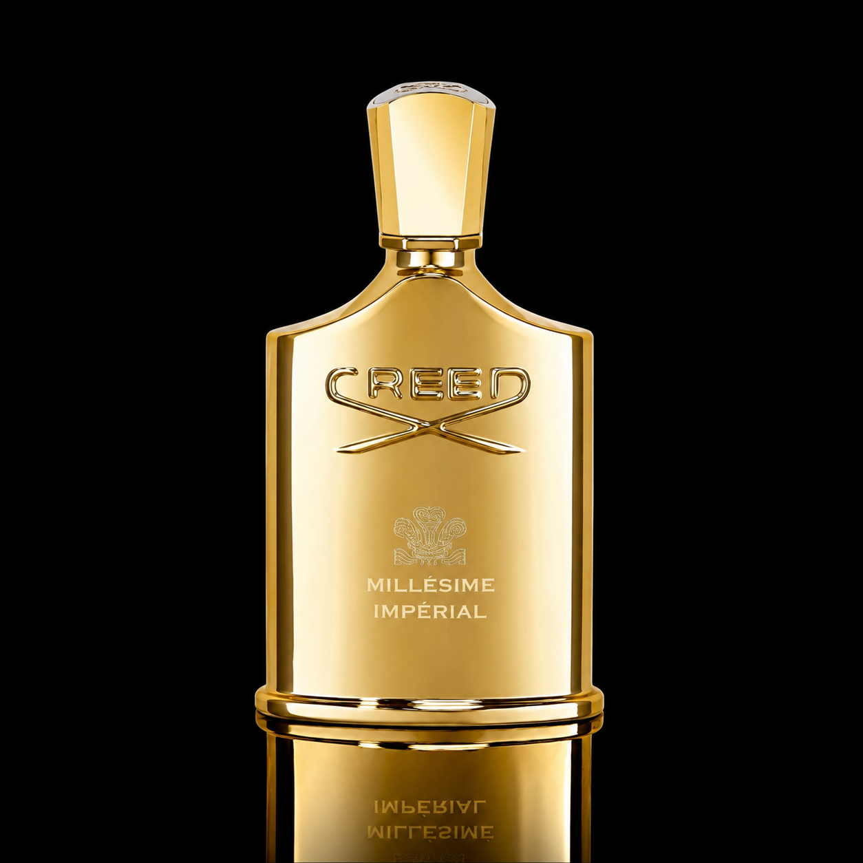 A gold Creed Millesime Imperial perfume bottle with a faceted cap, set against a solid black background with a reflective gold surface below.