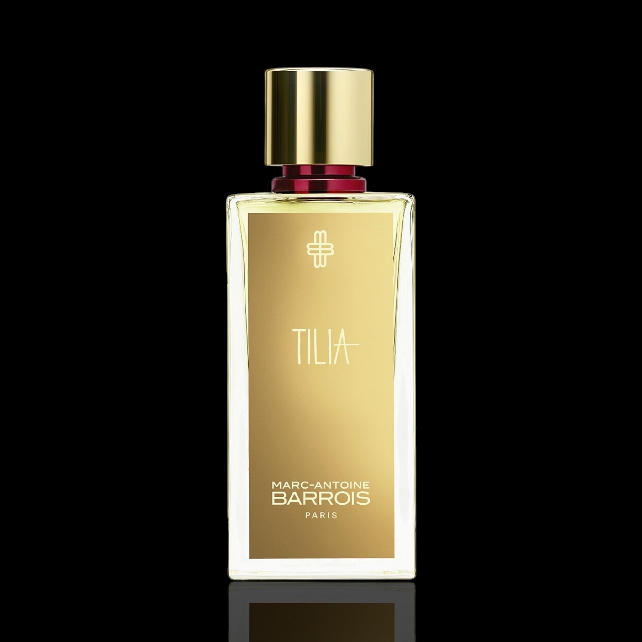Marc-Antoine Barrois Tilia+ perfume bottle with a gold cap and gold label, set against a solid black background.