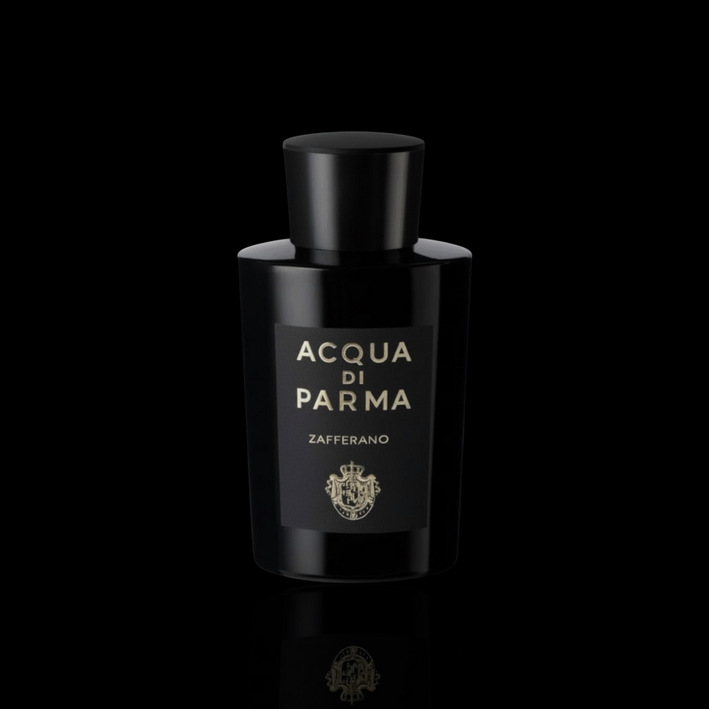 Acqua di Parma Zafferano bottle with black glass and gold lettering on a black reflective background.