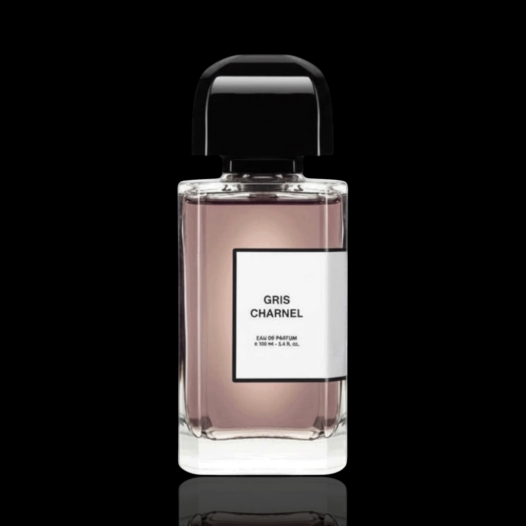 BDK Gris Charnel Eau de Parfum bottle with soft taupe-colored glass and black cap on a black reflective background.