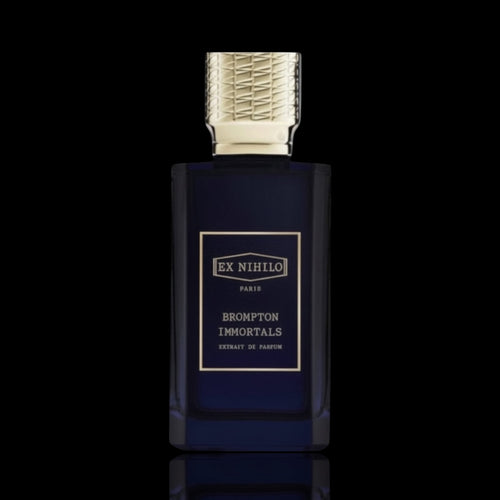 Ex Nihilo Brompton Immortals Extrait de Parfum bottle with deep blue glass and silver cap on a black reflective background.