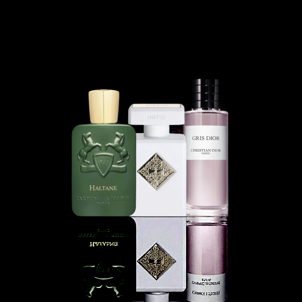 Parfums de Marly Haltane, Pernoire Anelo, and Christian Dior Gris Dior bottles displayed together on a black background with reflective surface