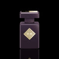 Initio Atomic Rose bottle with deep purple finish and gold emblem on a black background