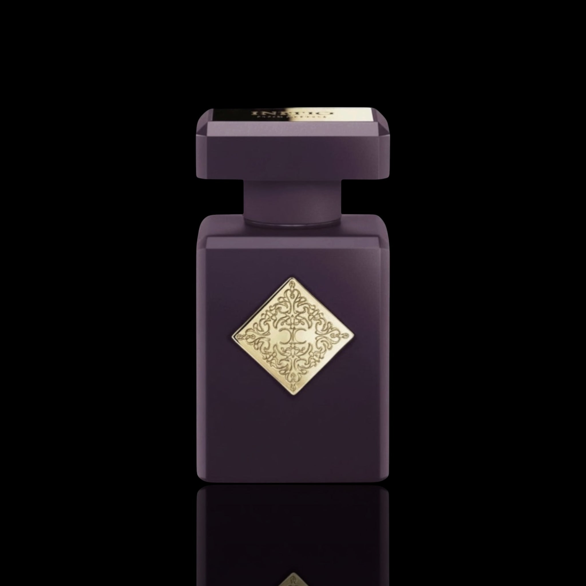 Initio Atomic Rose bottle with deep purple finish and gold emblem on a black background