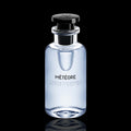 Louis Vuitton Météore bottle with light blue-tinted glass and black cap on a black reflective background.