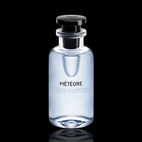Louis Vuitton Météore bottle with light blue-tinted glass and black cap on a black reflective background.