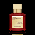 Maison Francis Kurkdjian Baccarat Rouge 540 Extrait perfume bottle with red glass and gold cap on a light background