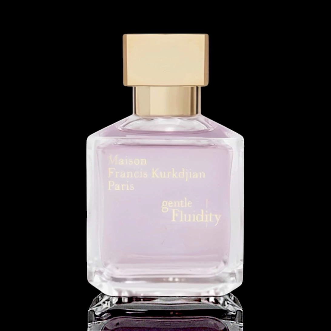 Maison Francis Kurkdjian Gentle Fluidity Gold bottle with soft pink glass and gold cap on a black reflective background.