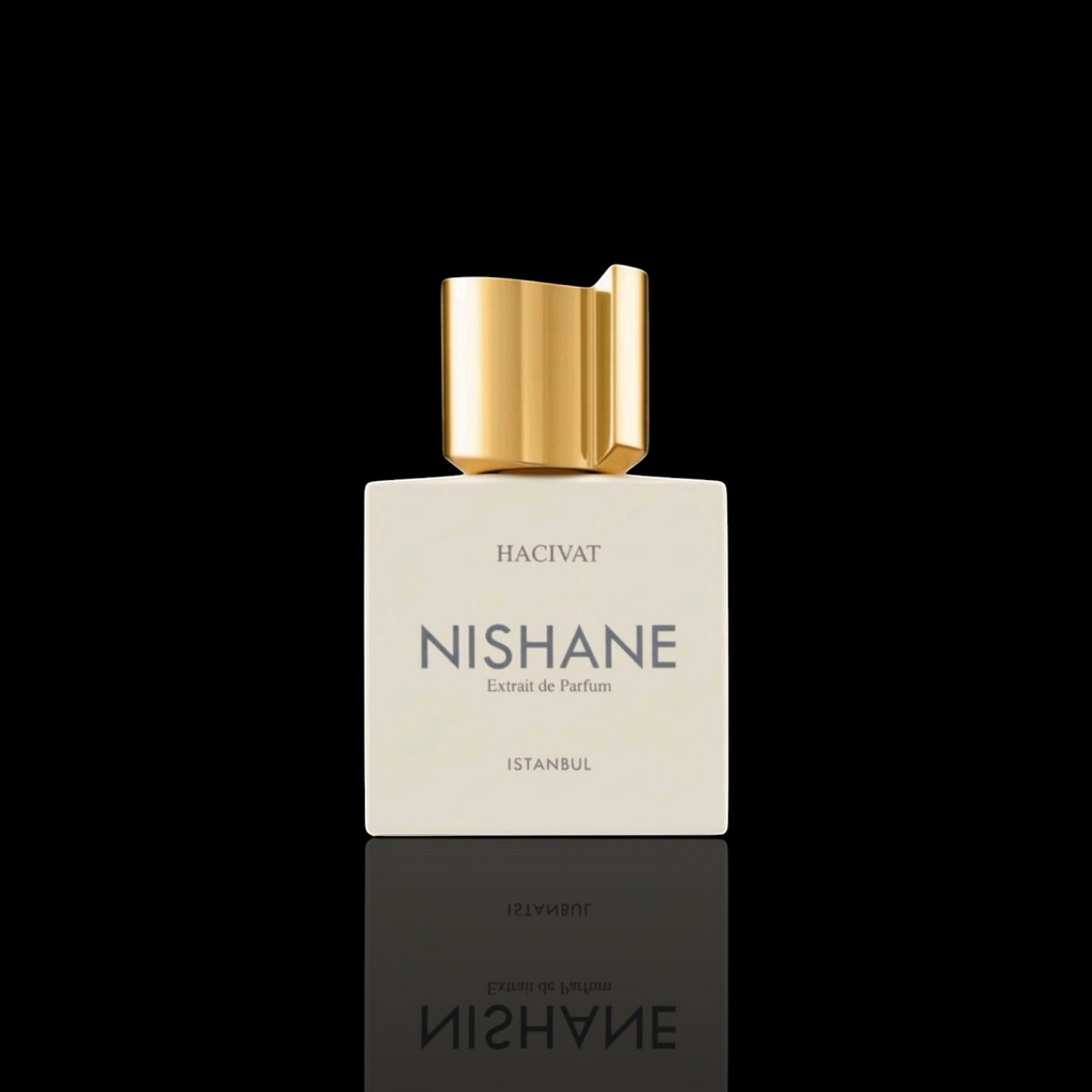 Nishane Hacivat Extrait de Parfum bottle with matte ivory finish and gold cap on a black reflective background.