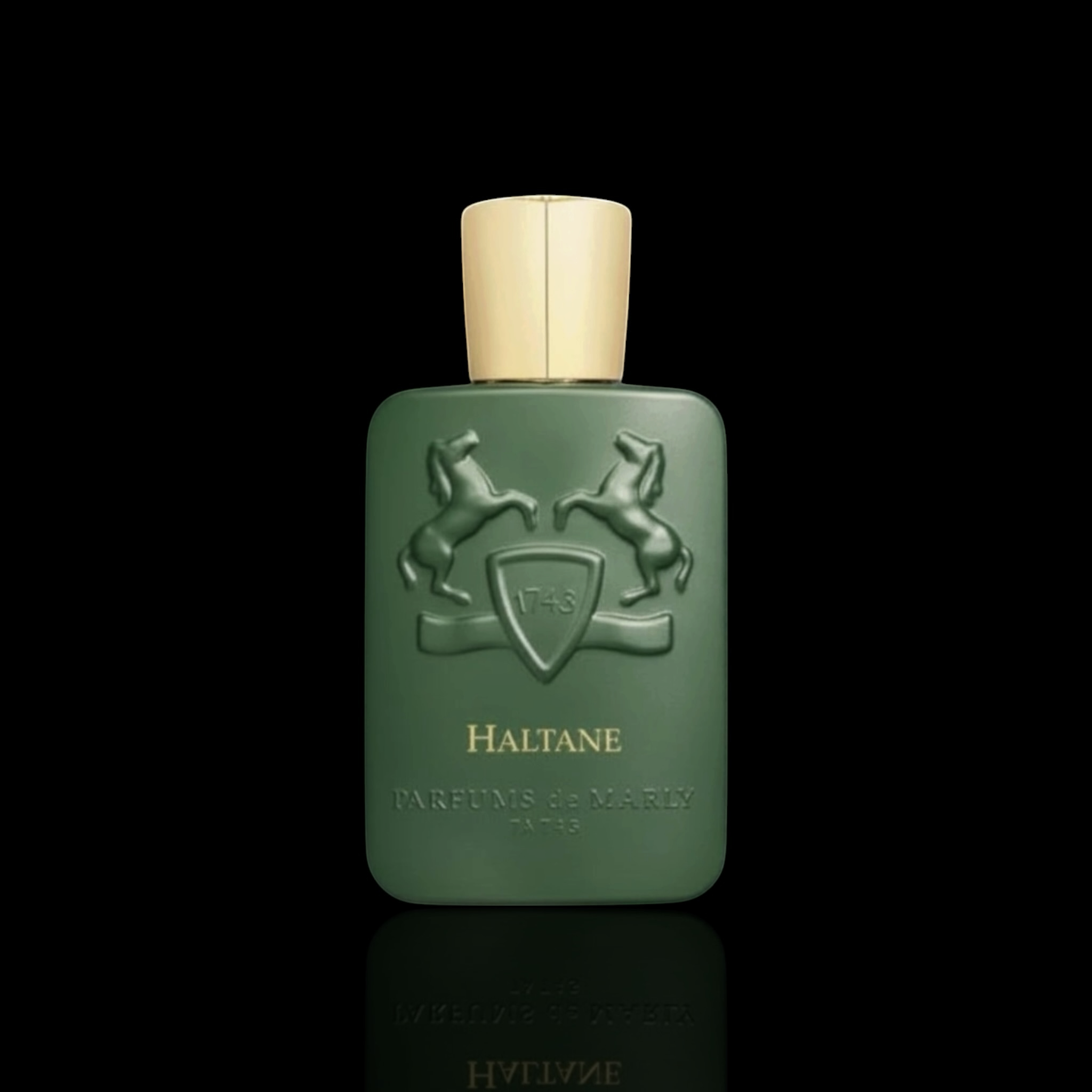 Parfums de Marly Haltane bottle with matte green finish and gold cap on a black reflective background.