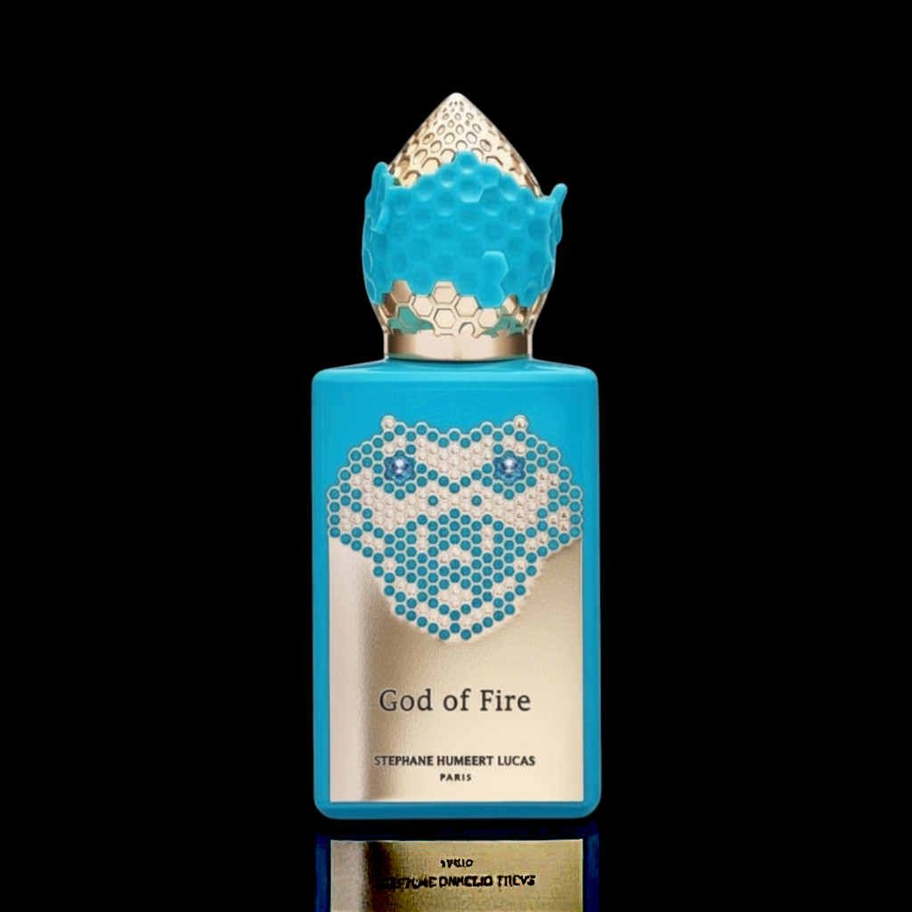 Stephane Humbert Lucas God of Fire bottle with turquoise blue design and decorative cap on a black background