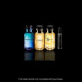 Three Louis Vuitton fragrance sample bottles on a black reflective background: a blue Afternoon swim bottle, a yellow L'Immensité bottle, a yellow lovers bottle, and a small black glass travel spray. Text at the bottom reads 'Full retail bottle not included with purchase.