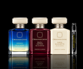 Ormonde Jayne Signature Collection featuring Verano, Bijou Zafran, and Suede Silhouette fragrance bottles beside a Rare Reserve Group decant atomizer on a black reflective background