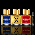Nishane Fan Your Flames, Wulong Cha X, and Hundred Silent Ways perfume bottles alongside Rare Reserve Group branded decant atomizer on glossy black reflective background