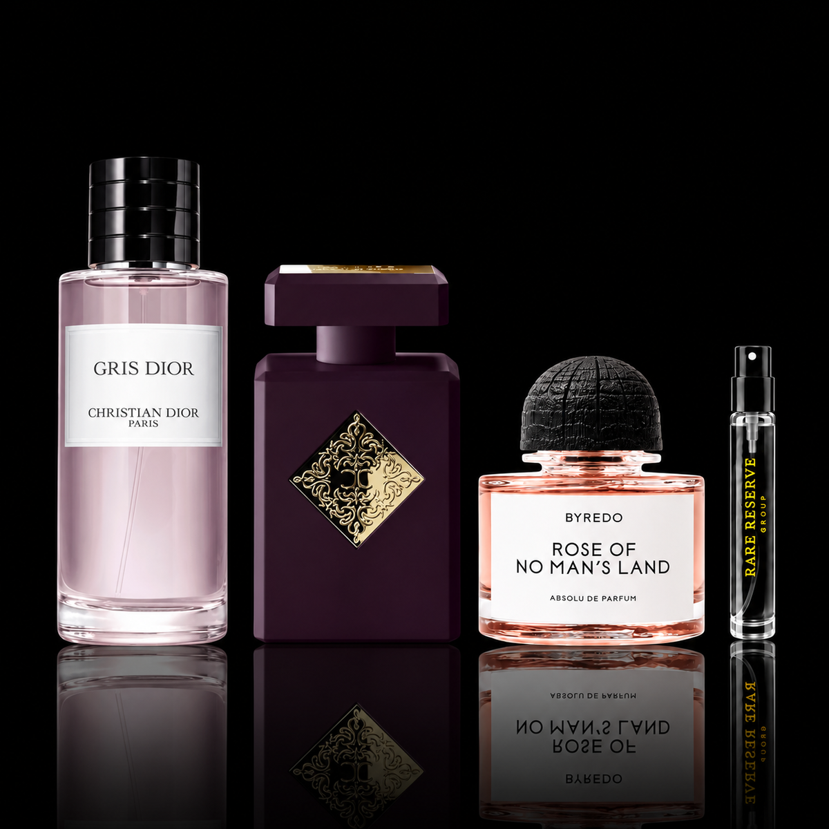 Rose Reserve Collection featuring Atomic Rose, Rose of No Man’s Land Absolu and Gris Dior EDP source bottles beside a Rare Reserve Group decant atomizer. Full retail bottles not included.